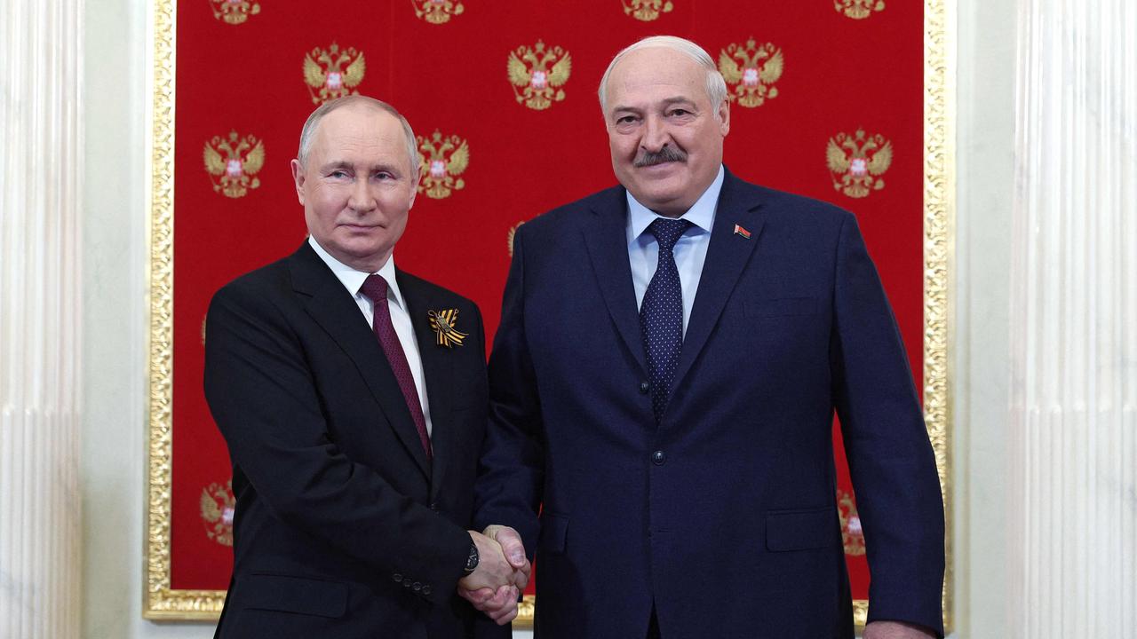 Vladimir Putin with Belarus' President Alexander Lukashenko at the Kremlin. Picture: AFP.