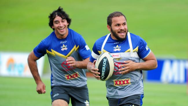 Matt Bowen is chased by Johnathan Thurston at a Cowboys training session.