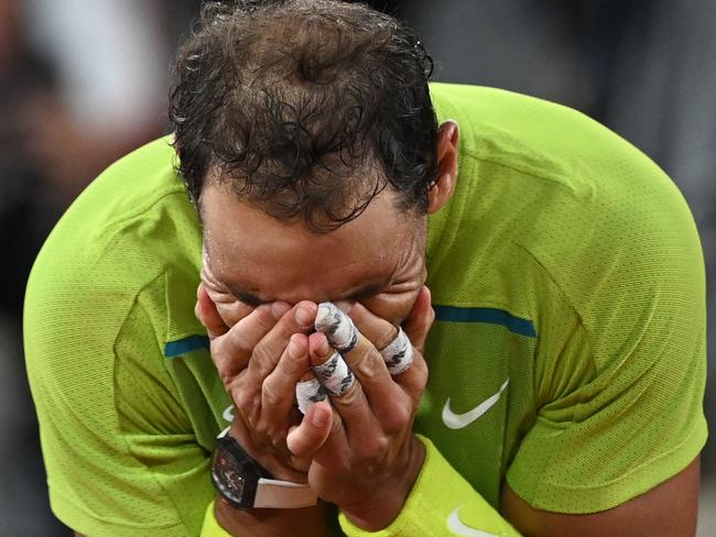 Spain's Rafael Nadal reacts after winning against Serbia's Novak Djokovic at the end of their men's singles match on day ten of the Roland-Garros Open tennis tournament at the Court Philippe-Chatrier in Paris early June 1, 2022. (Photo by Anne-Christine POUJOULAT / AFP)