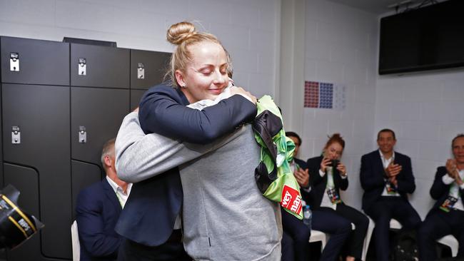 Unforgettable moment: Sharpe is presented with her game jersey in the referees’ rooms. Picture: Sam Ruttyn