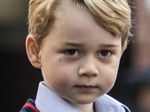 Britain's Prince George arrives for his first day of school at Thomas's school in Battersea, southwest London on September 7, 2017. / AFP PHOTO / POOL / RICHARD POHLE