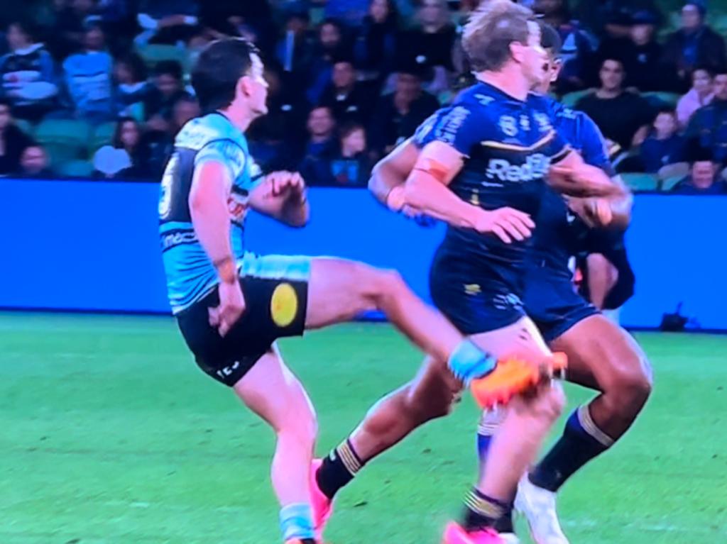 Harry Grant makes late contact with Daniel Atkinson's kicking leg.