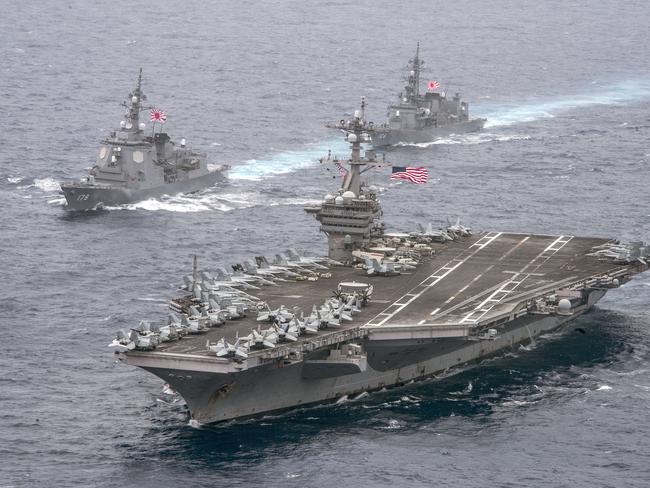 U.S. Navy, the aircraft carrier USS Carl Vinson (CVN 70), foreground, transits the Philippine Sea, ready to act. Picture: Getty