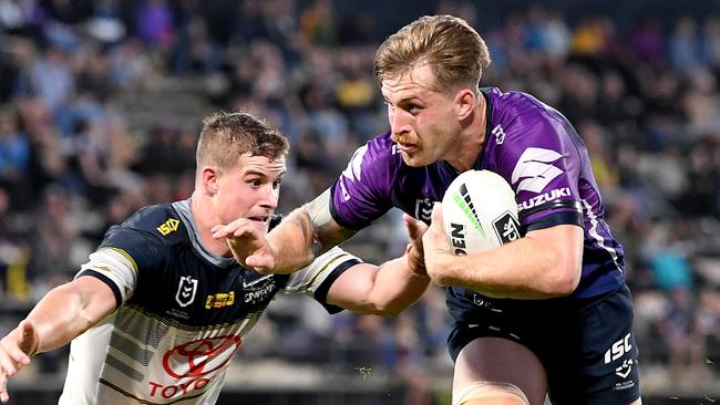 Storm five-eighth Cameron Munster tries to evade the Cowboys defence at Sunshine Coast Stadium. Picture: Getty Images