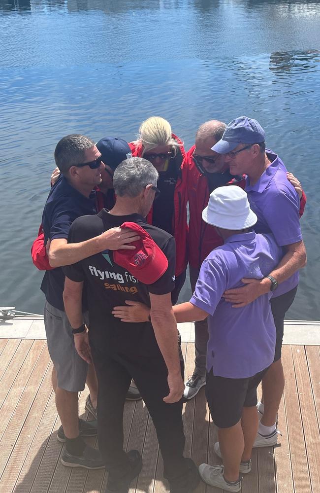 Friends of two sailors killed during the Sydney to Hobart gather for a tribute at Constitution dock in Hobart.