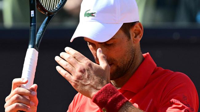 ‘Concerned’ Djokovic set for scans as shock exit follows bottle blow