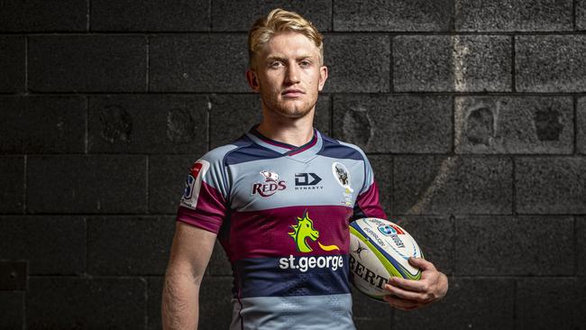 Utility back Isaac Lucas shows off the new Queensland Reds alternate jersey that will be worn in trials and when jersey colours clash on the road in 2020. Picture: Brendan Hertel, QRU