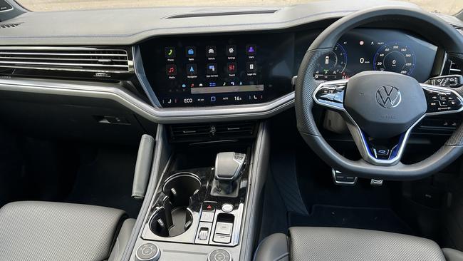 Inside the Volkswagen Touareg R features plush leather trim, four-zone aircon, sports steering wheel, brushed aluminium inserts and a dash with blue illumination.