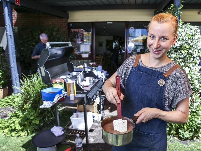 Barista at Stirling’s Red Cacao Chocolatier Yvi Ullmer makes hot chocolate on a barbecue after the shop was left without power.<b> Picture: MIKE BURTON</b>