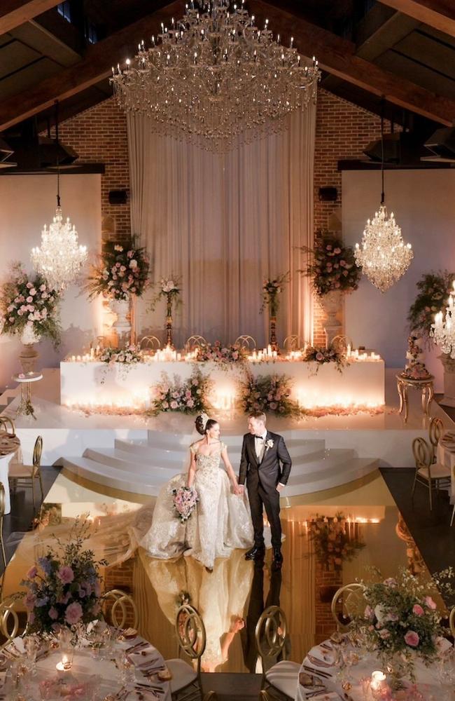 The reception was adorned with pastel blooms, crystal vases, and countless French pear-scented candles. Photo: Instagram.