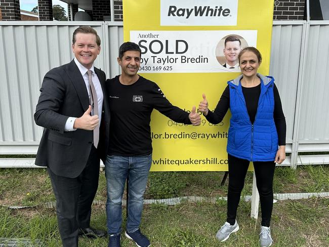 Taylor Bredin with first home buyers Afshin Khaniardestani and Atoosa Hedayat. NSW Real Estate.