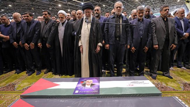 Ayatollah Ali Khamenei and Iranian President Masoud Pezeshkian (C-R), lead prayers over the coffin of late Hamas leader Ismail Haniyeh and his bodyguard. Picture: AFP.