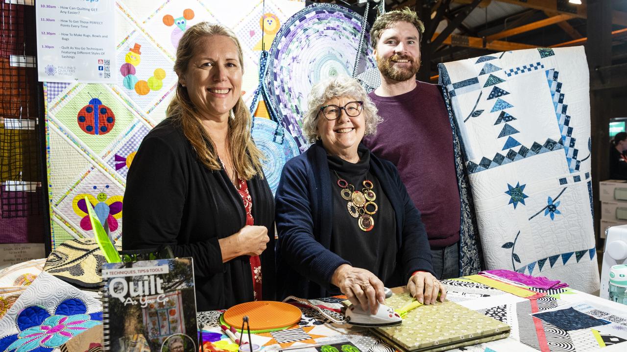 Pauline Rogers (centre) of Cabarlah's Pauline's Quilters World demonstrates sasher collection tools with Jo Cantly and Simon Pratt at Craft Alive at the Goods Shed, Saturday, May 21, 2022. Picture: Kevin Farmer