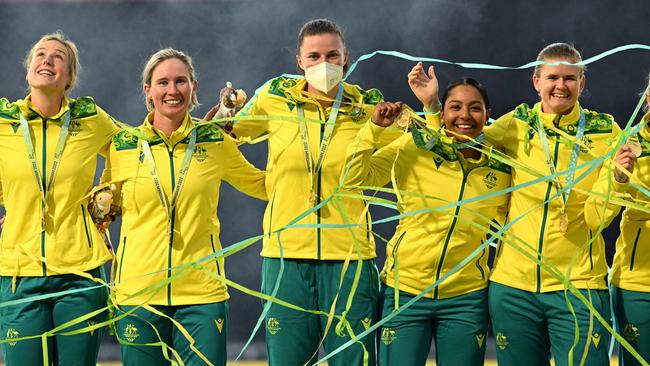 Tahlia McGrath (middle) is seen as the Australian Women’s cricket team celebrate victory in the Women’s T20 Cricket Final between India and Australia in Birmingham. Picture: AAP Image/Dave Hunt