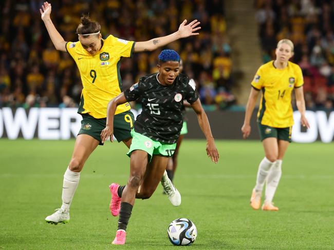 Caitlin Foord and Rasheedat Ajibade compete for the ball