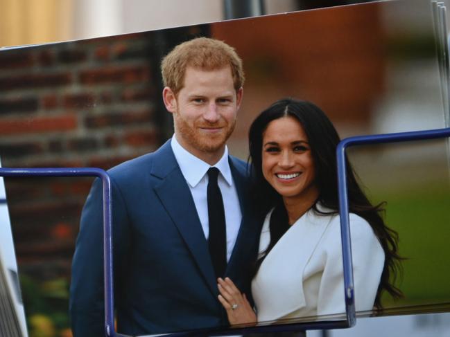 Royal memorabilia featuring Britain's Prince Harry, Duke of Sussex, and Meghan, Duchess of Sussex is displayed for sale in a store near Buckingham Palace in London on January 10, 2020. - Prince Harry's wife Meghan has returned to Canada following the couple's bombshell announcement that they were quitting their frontline royal duties, it emerged Friday, as the monarch held urgent talks with her family to resolve the crisis. (Photo by DANIEL LEAL-OLIVAS / AFP)