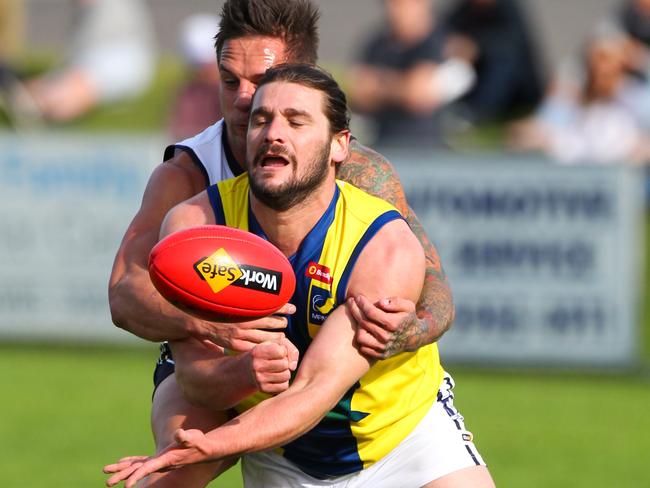 Northern Football League was beaten by Mornington Peninsula Nepean Football League in the AFL Victoria Community Championship. The MPFNL prevailed 18.14 (122) to 14.8 (92) at Rye Oval, withstanding a second-half surge from the NFL side. Kevin Lylak get a hadball away. Picture: David Trend