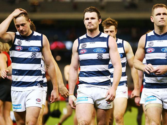 MELBOURNE, AUSTRALIA - MAY 19:  Mitch Duncan (L) Patrick Dangerfield and Joel Selwood (R) lead the team off after defeat during the round nine AFL match between the Essendon Bombers and the Geelong Cats at Melbourne Cricket Ground on May 19, 2018 in Melbourne, Australia.  (Photo by Michael Dodge/Getty Images)