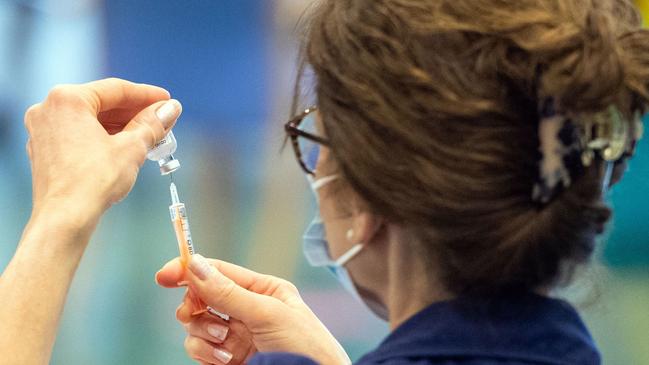 A nurse prepares a dose of the Oxford/AstraZeneca COVID-19 vaccine in Epsom, southern England, this week. Picture: AFP