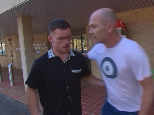 Tom Starling leaving Gosford Police Station into the arms of his dad after his arrest. Picture: 9 News