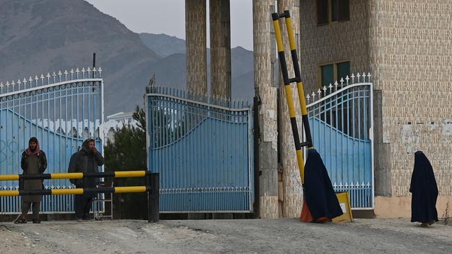 One small group of women, wearing the all-covering burqa, enter Laghman University early on Wednesday. Picture: AFP