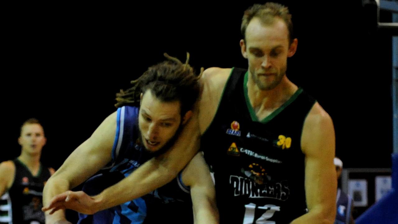 Basketball.  Chargers forward Craig Moller tries to defend the ball from Mt Gambier's Lewis Thomas.  Hobart Chargers V Mount Gambier Pioneers at the DEC.  Picture: FIONA HARDING