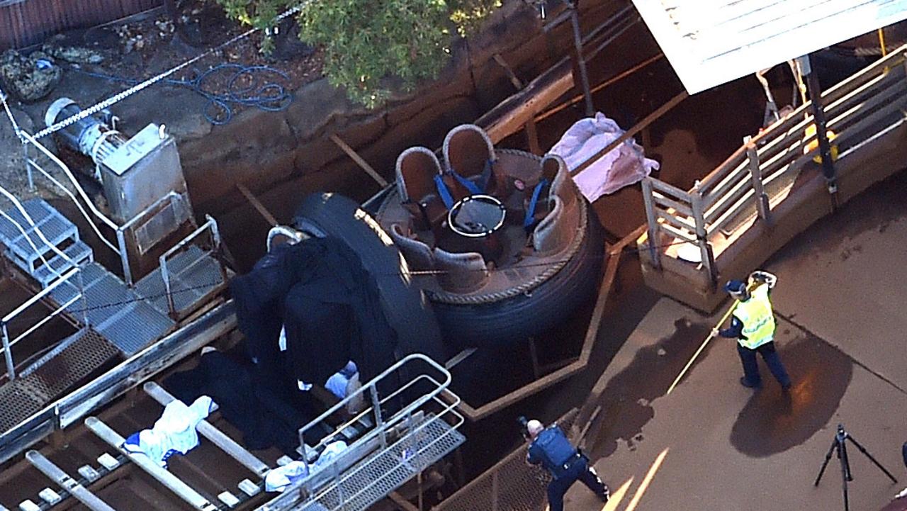 Queensland Emergency service personnel surrounding the ride in question at the amusement theme park on Tuesday, October 25, 2016. AAP Image/Dan Peled