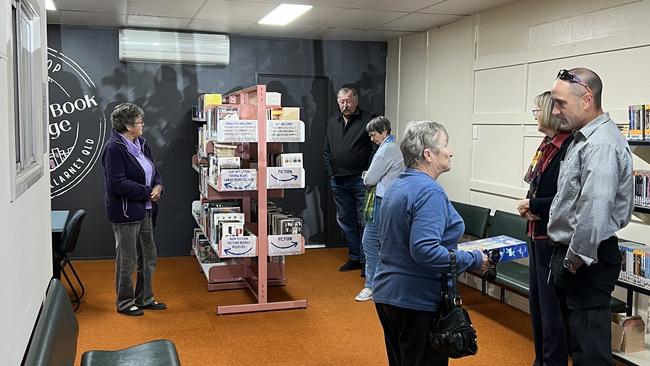 Community members taking their first browse through the collections at Killarney Co-op's Book Exchange.