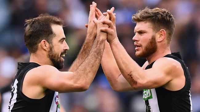 Steele Sidebottom and Taylor Adams celebrate a goal. Picture: QUINN ROONEY