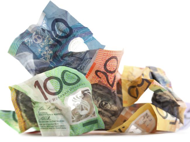 Crumpled Australian dollars on white background.