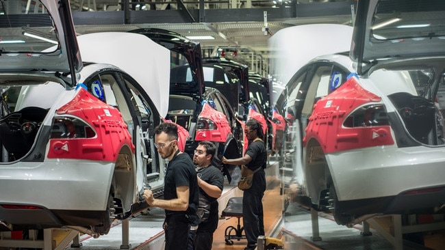 Tesla workers assembled cars at the company’s factory in Fremont, California. Picture: Getty Images