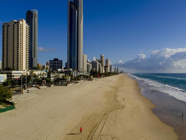 ### ON HOLD - SEE GCB FOR USE ###Drone footage of Gold Coast landmarks now empty due to Coronavirus (COVID-19). Surfers Paradise beach and Gold Coast / Surfers Paradise Skyline. Picture:  Jerad Williams