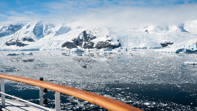 Cruise through the icy waters of Paradise Bay, Antarctica.