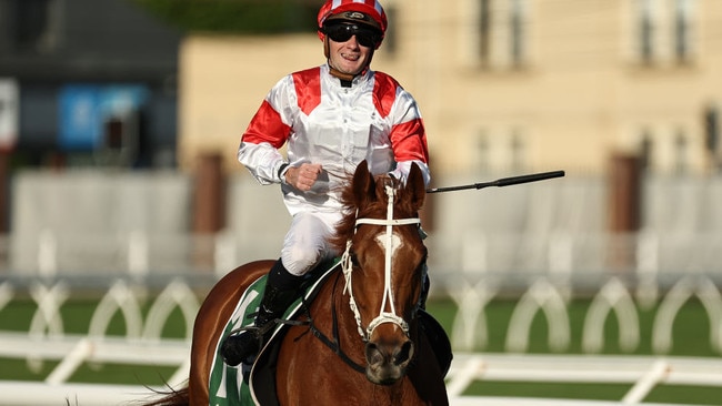 Reece Jones celebrates his first Group 1 success aboard Land Legend in the Metropolitan at Randwick on Saturday. Photo: Jeremy Ng/Getty Images.