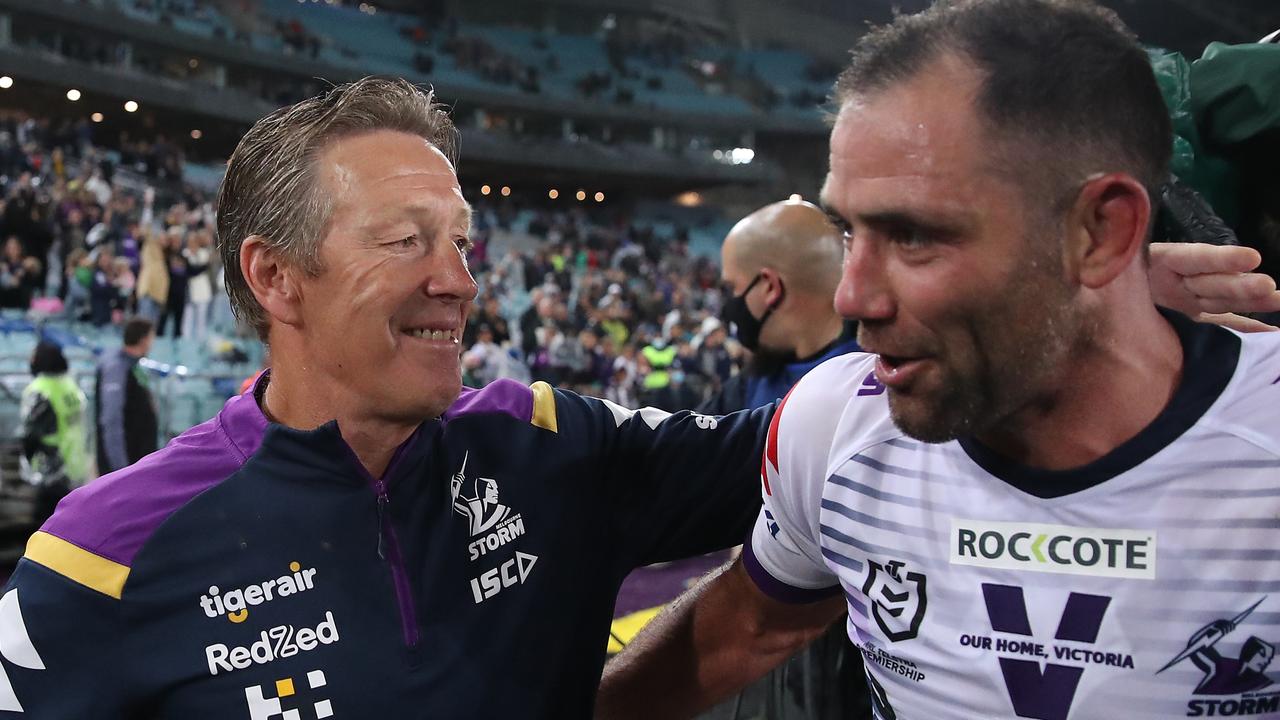 Cameron Smith and Craig Bellamy celebrate the 2020 Grand Final win.