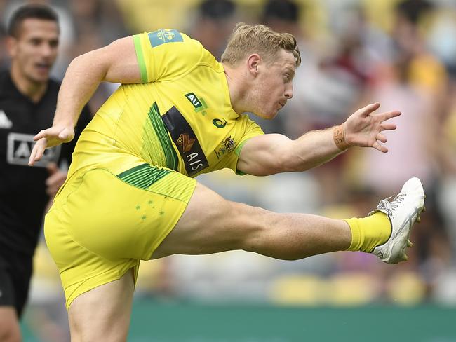 Lachlan Miller of Australia kicks the ball during the Oceania Sevens Challenge match between New Zealand and Australia at Queensland Country Bank Stadium. (Photo by Ian Hitchcock/Getty Images)