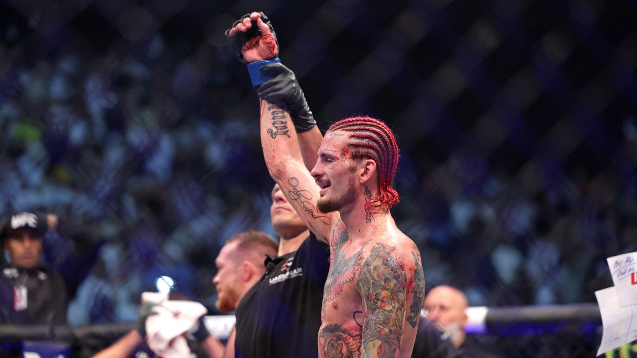 Sean O'Malley wins against Petr Yan in their bantamweight bout at the Ultimate Fighting Championship (UFC) event at the Etihad Arena in Abu Dhabi on October 22, 2022. (Photo by Giuseppe CACACE / AFP)
