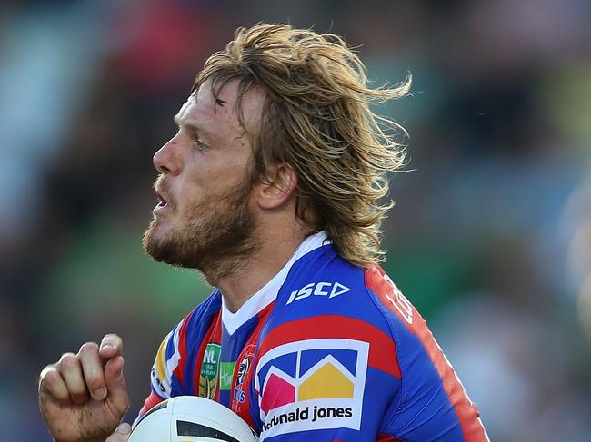 NEWCASTLE, AUSTRALIA - FEBRUARY 24:  Nathan Ross of the Knights is tackled  during the NRL Trial Match between the Newcastle Knights and the Parramatta Eels at Maitland No 1 Showground on February 24, 2018 in Newcastle, Australia.  (Photo by Tony Feder/Getty Images)