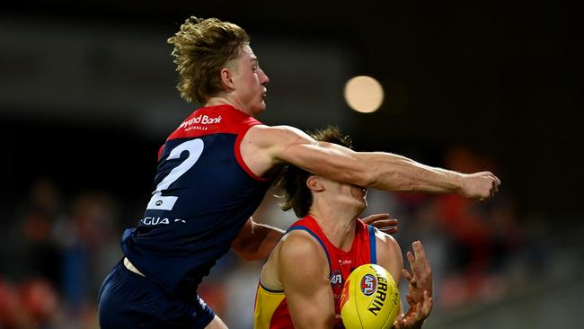 GOLD COAST, AUSTRALIA - MAY 06: Charlie Ballard of the Suns suffers an injury while challenging for the ball against Jacob van Rooyen of the Demons  during the round eight AFL match between the Gold Coast Suns and the Melbourne Demons at Heritage Bank Stadium, on May 06, 2023, in Gold Coast, Australia. (Photo by Albert Perez/AFL Photos via Getty Images)