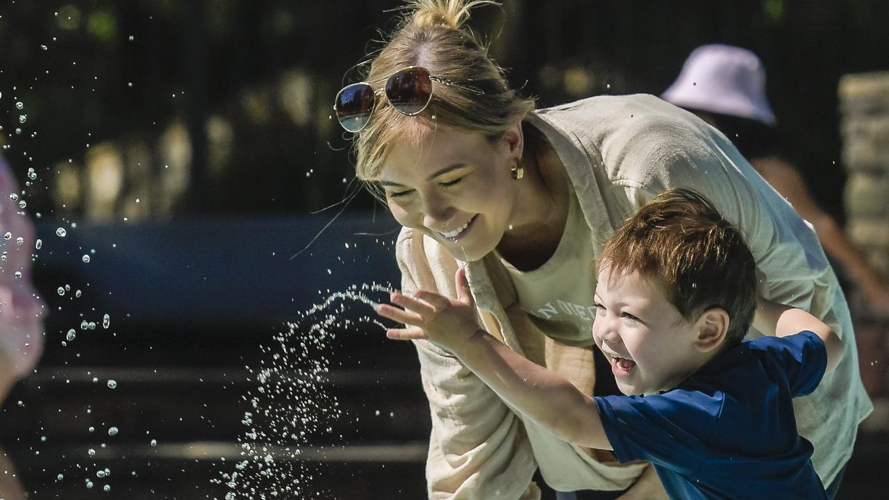 Lauren and Kailo, 3, enjoy the water at Tusmore wading pool. Picture: NCA NewsWire / Roy VanDerVegt