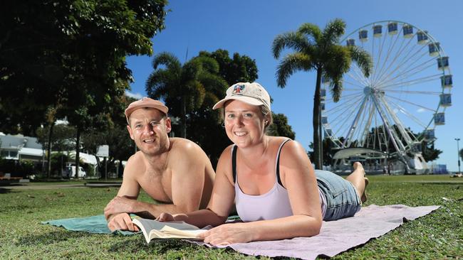 Tyler Everson and Mia Lute from the Mornington Peninsula in Victoria enjoy soaking up the sun's rays on the Esplanade. Picture: Brendan Radke