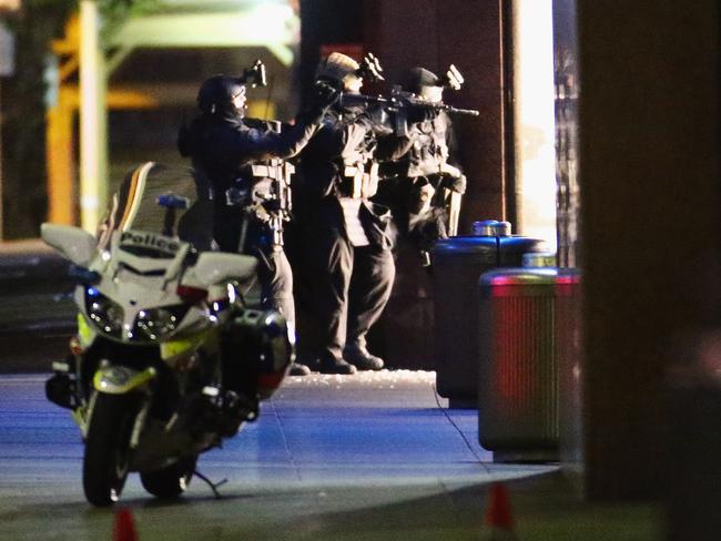 Heavily armed police take aim outside the Lindt Cafe in Martin Place. Picture: Don Arnold/Getty Images