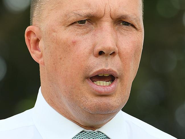 Minister for Home Affairs Peter Dutton speaks to the media during a doorstop in Kallangur, Queensland, Thursday, February 7, 2019. (AAP Image/Albert Perez) NO ARCHIVING