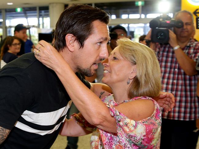 Mitchell Pearce his greeted by his mum Terri after arriving in Sydney. Picture Gregg Porteous