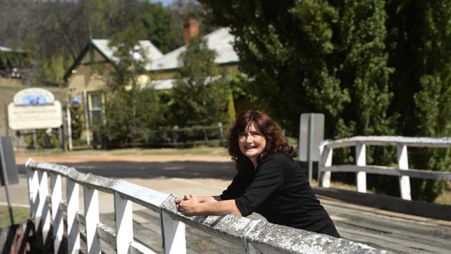 Blue Duck Inn part-owner Lana Antony at the historic time bridge in 2014 when the Omeo Highway was fully sealed between Omeo and Mitta Mitta.