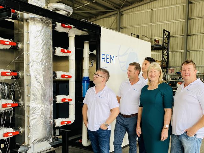 Darwin Hydrogen trial. Minister for Renewable Energy Eva lawler inspects Aqua Aerem's mini Hydrogen plant with its creators (L-R  Jarrod Ward, Gerard Reiter,)  which will be trialled at Tennant Creek.Extreme right is Anthony Reiter Background is Steven Vassiloudis PICTURE GARY SHIPWAY