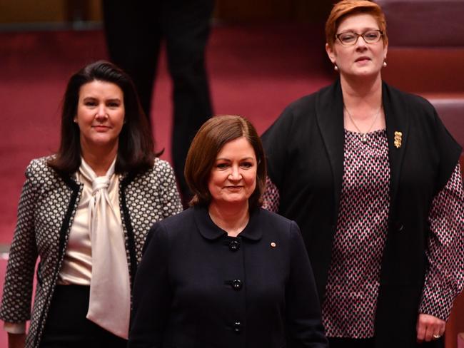 A momentous occasion not just for her: Liberal Senator Sarah Henderson is escorted to be sworn in by Liberal Senators Jane Hume (L) and Marise Payne (R) in the Senate. Picture: AAP Image/Mick Tsikas