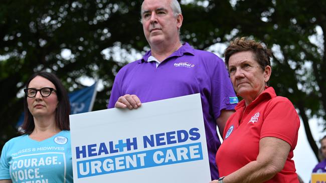 Dr Sandy Donald (centre) outside the Cairns Base Hospital. Picture: Emily Barker