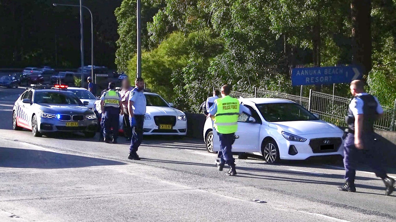 Officers from Coffs/Clarence Traffic and Highway Patrol following an alleged high speed pursuit which started at Glenugie and ended near the Big Banana at Coffs Harbour. Photo: Frank Redward