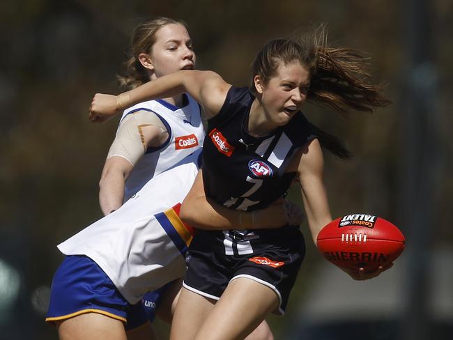 MELBOURNE, AUSTRALIA - SEPTEMBER 16: Sara Howley of the Falcons handballs whilst being tackled by Evie Parker of the Ranges during the Coates Talent League Girls Preliminary Final match between Eastern Ranges and Geelong Falcons at Shepley Oval on September 16, 2023 in Melbourne, Australia. (Photo by Daniel Pockett/AFL Photos/via Getty Images)